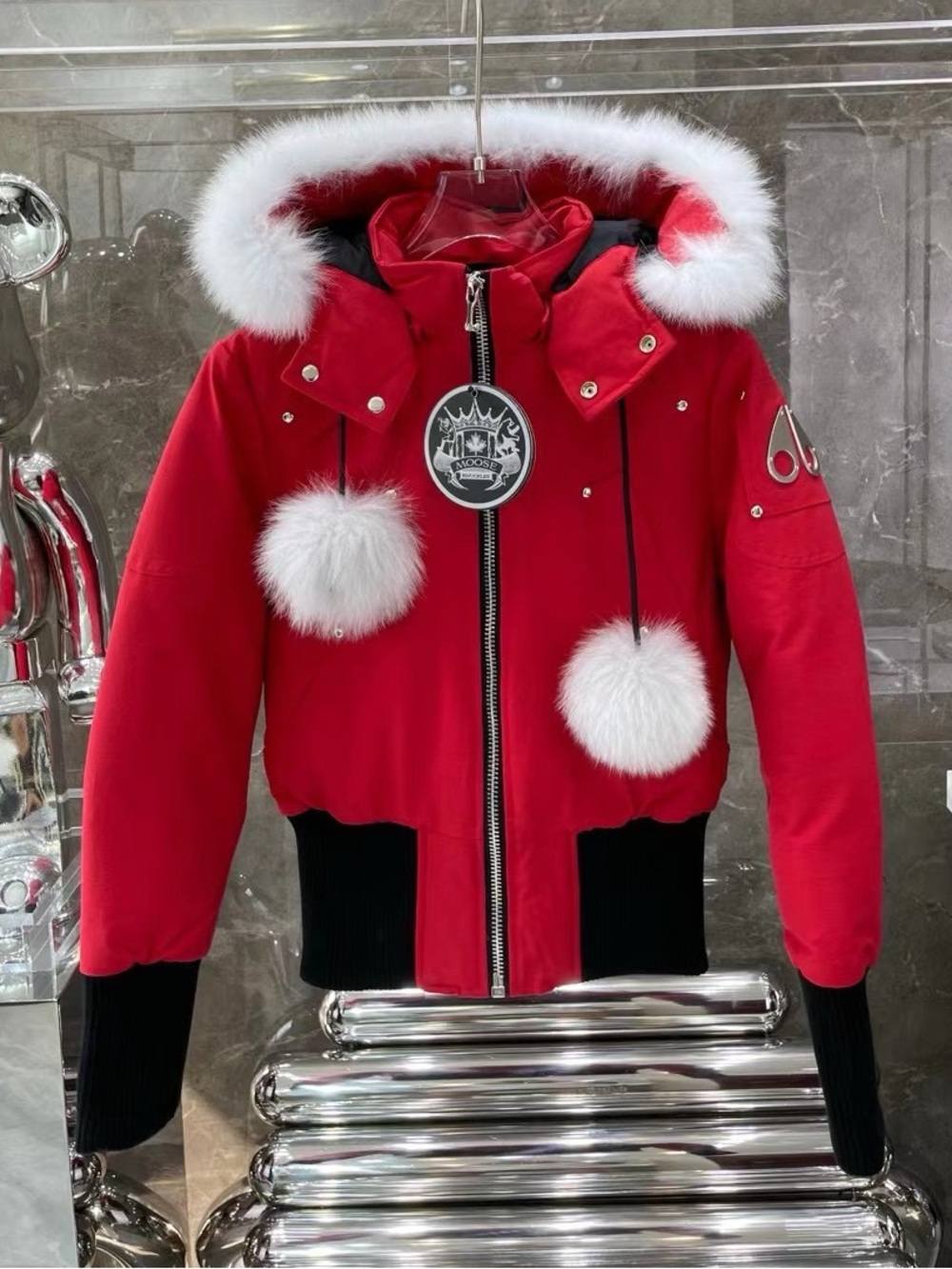 Moose Knuckles Red Jacket with White Fur Hood and Pom-Poms